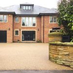 Gold resin driveway outside house in Croydon